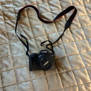 Canon EOS Black Digital Camera with Red Accents